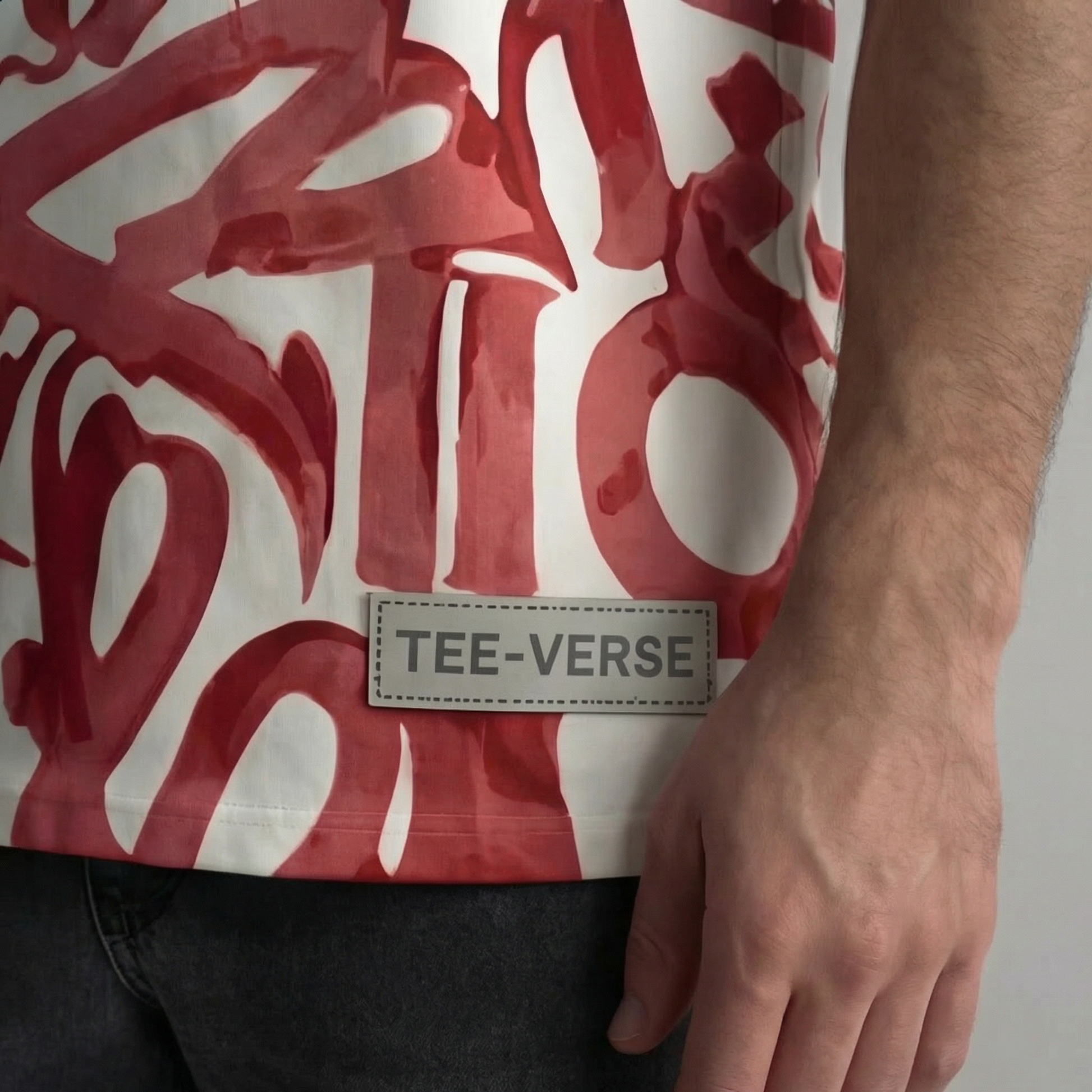 Red and white patterned shirt with 'TEE-VERSE' label on a plain background