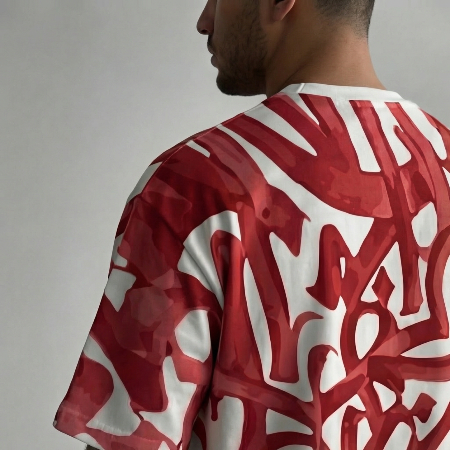 Upper Body View of The Artistic Rebel Oversized Tee – Bold Red Calligraphy All-Over Print Streetwear India